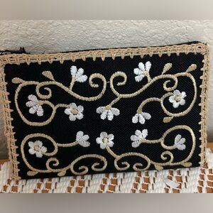Embroidered cloth card case. Zipper closure.